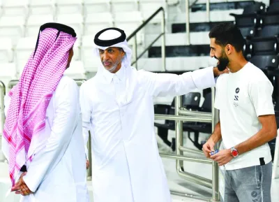 Minister of Sports and Youth HE Sheikh Hamad bin Khalifa bin Ahmed al-Thani with former Qatar captain Hassan al-Haydos, who retired from national duty recently, at Qatar team’s training on Wednesday.