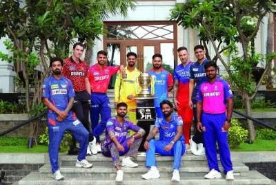 
Captains of the Indian Premier League sides pose with the trophy.  