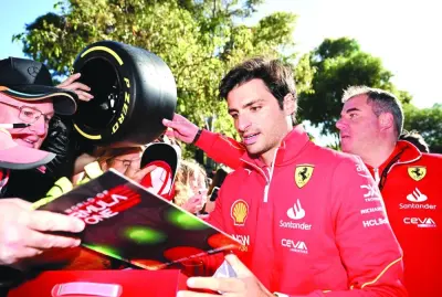 
Ferrari’s Carlos Sainz Jr. with fans ahead of the Australian Grand Prix. (Reuters) 