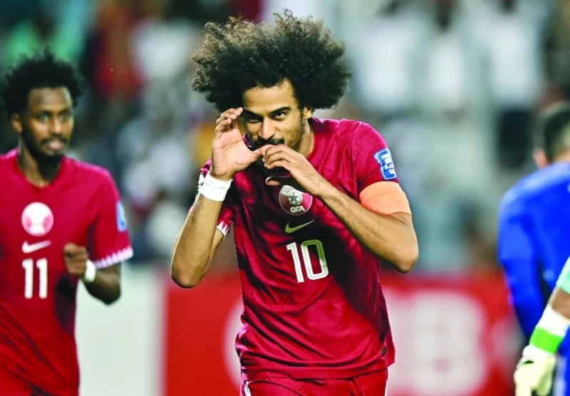 Akram Afif celebrates after scoring against Kuwait  during the preliminary joint qualification – Round 2 match for the FIFA World Cup 2026 and AFC Asian Cup 2027 at the Jassim Bin Hamad Stadium in Doha on Thursday. PICTURES: Noushad Thekkayil
