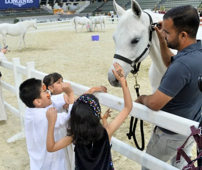 Children petting an Arabian horse at the Ramadan Nights programme at Al Shaqab Friday. PICTURE: Shaji Kayamkulam.