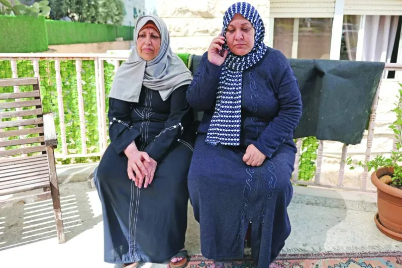 
Palestinians Rim Abu Obeida (left) and Manal Abu Shaaban from the Gaza Strip sit on a bench in a small hotel near the Augusta Victoria Hospital in east Jerusalem, where they received radiation therapy, yesterday. 