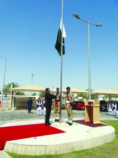 Ambassador Muhemmed Aejaz hoisting the national flag.
