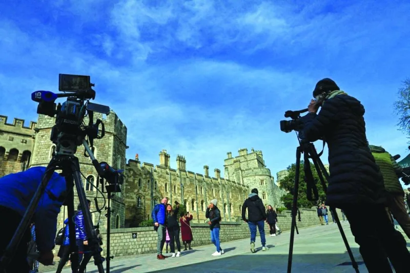 
Members of the media work outside Windsor Castle, the day after the news of cancer diagnosis. 