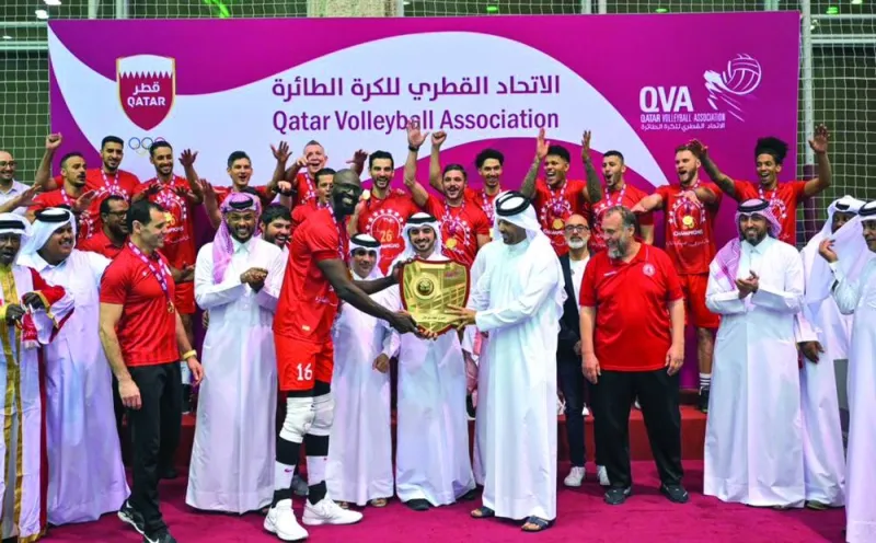 
Action from the match between Al Arabi and Al Rayyan. Qatar and West Asian Volleyball Federations president Ali Ghanem al-Kuwari presents the Qatar Volleyball League shield to Al Arabi captain Mohamed Ibrahim after the final round match on Friday night. 