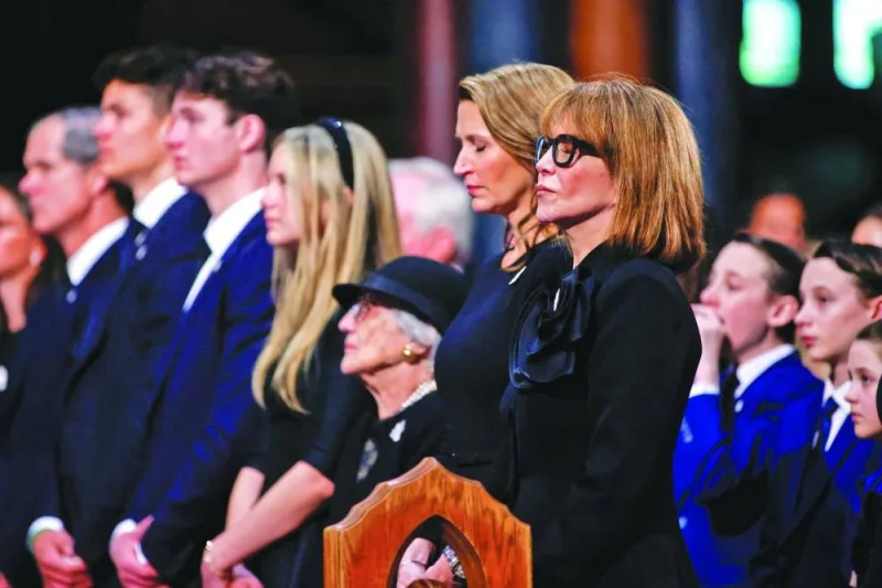 Mila and Caroline Mulroney close their eyes during prayer at a state funeral of their husband and father, late former prime minister Brian Mulroney at the Notre-Dame Basilica of Montreal, Quebec, on Saturday. (Reuters)