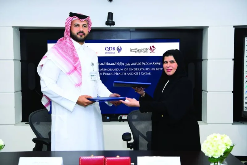 Dr Aisha al-Ansari and Dr Hamad Salem Mejegheer during the signing ceremony.