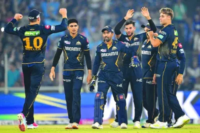 
Gujarat Titans’ players celebrate after the dismissal of Mumbai Indians’ Gerald Coetzee during the Indian Premier League (IPL) Twenty20 match in Ahmedabad yesterday. (AFP) 