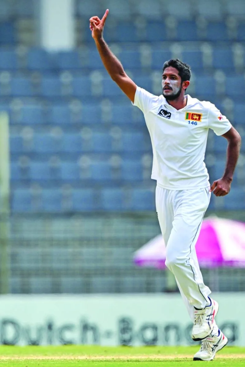 Sri Lankan fast bowler Kasun Rajitha celebrates after taking the wicket of Bangladesh’s Mehidy Hasan Miraz during the fourth day of the first Test at the Sylhet International Cricket Stadium in Sylhet on Monday. (AFP)