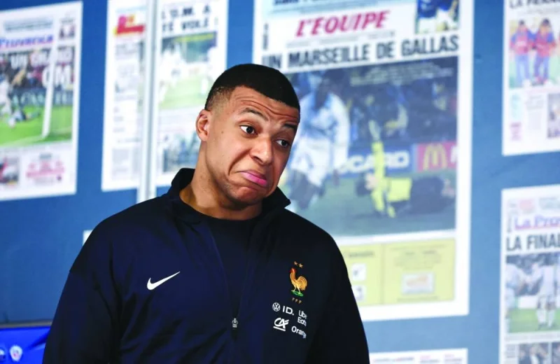 France’s forward Kylian Mbappe arrives at a press conference in Marseille on Tuesday, on the eve of a friendly against Chile at Velodrome stadium.