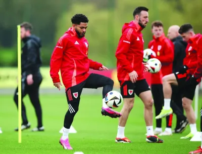 Wales’ Jay Dasilva trains with teammates on Tuesday, ahead of the Euro 2024 play-off final against Poland. (Reuters)