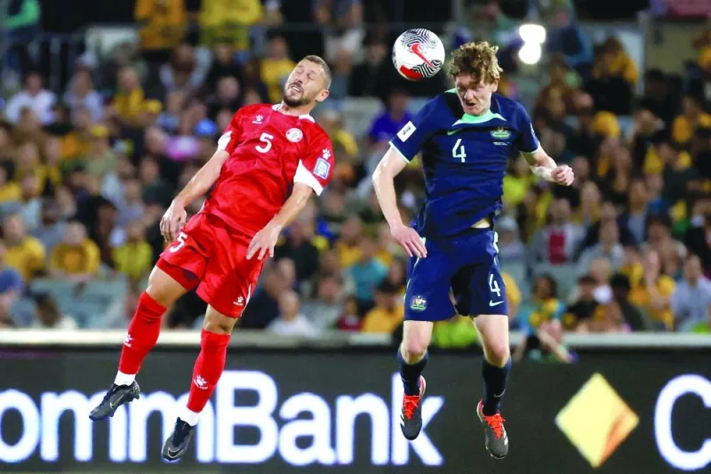 
Australia’s Kye Rowles (right) vies for the ball with Lebanon’s Nassar Nassar during the FIFA World Cup 2026 and Asian Cup 2027 qualifier match in Canberra. (AFP) 