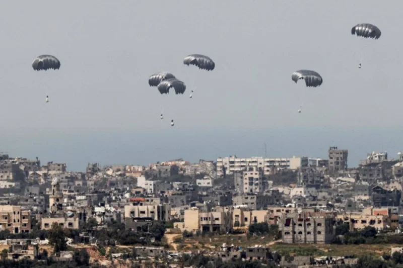 This picture taken from Israel&#039;s southern border with the Gaza Strip shows parachutes of humanitarian aid dropping over the besieged Palestinian territory on Wednesday. AFP