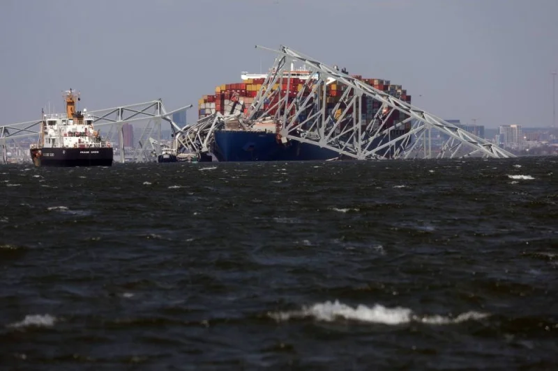 Wreckage from the Francis Scott Key Bridge rests on the Dali cargo ship on Friday in Baltimore, Maryland. AFP