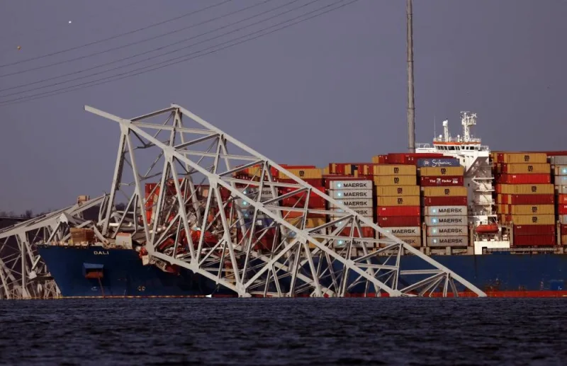 Wreckage from the Francis Scott Key Bridge rests on the Dali cargo ship on Friday in Baltimore, Maryland.  AFP