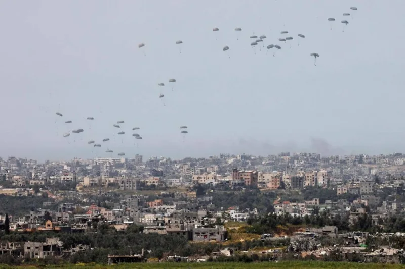 This picture taken from Israel&#039;s southern border with the Gaza Strip shows a military aircraft releasing parachutes of humanitarian aid over the besieged Palestinian territory on Wednesday. AFP