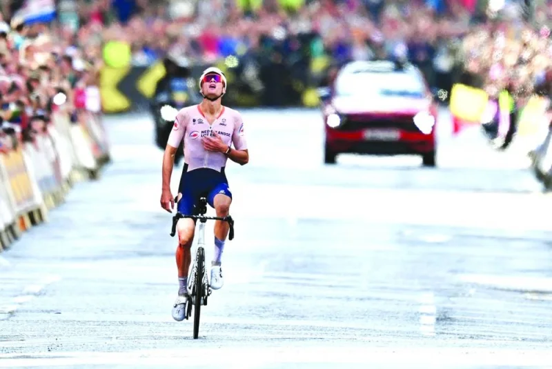 Netherland’s Mathieu van der Poel reacts after winning the men’s Elite Road Race at the Cycling World Championships in Edinburgh, Scotland, on Sunday. (AFP)