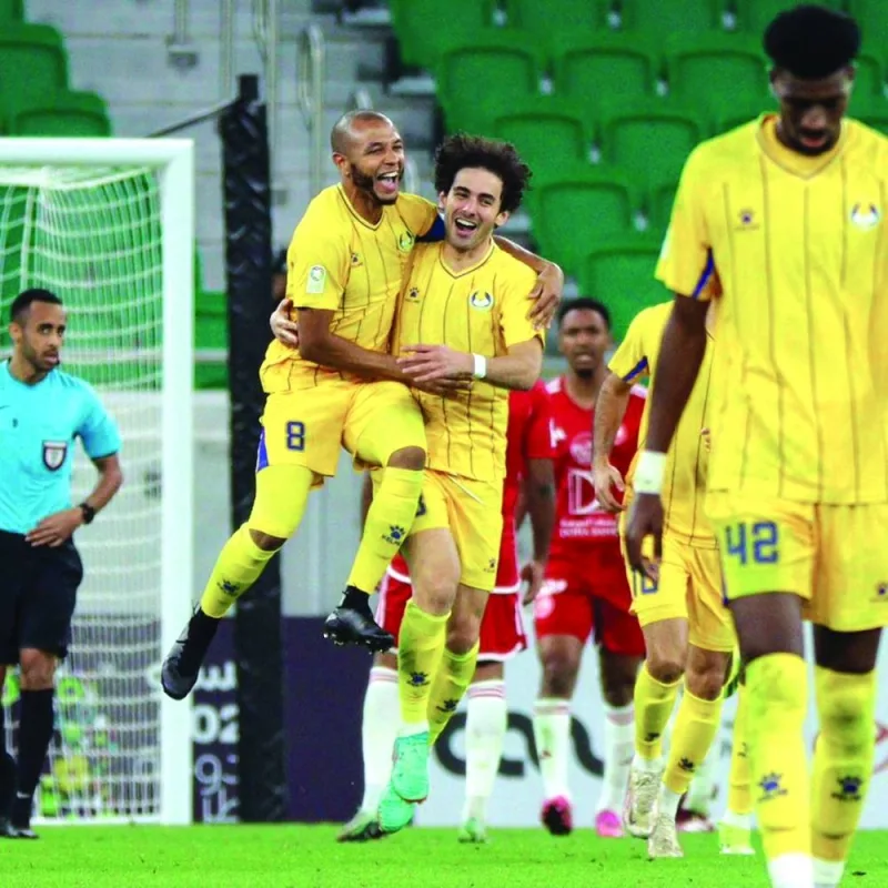 Al Gharafa’s Ahmed Alaaeldin (right) celebrates with Yacine Brahimi after scoring against Al Arabi on Saturday.