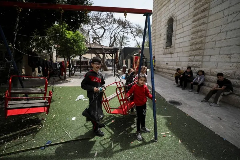 Palestinian children, who were displaced from their homes due to Israel&#039;s military offensive, play at the Holy Family church where they take shelter, as Gaza Christians mark Easter amid muted festivities due to the ongoing conflict between Israel and Hamas, in Gaza City, on Thursday. REUTERS