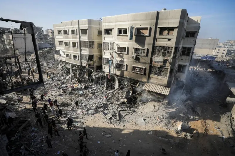 Palestinians inspect the damages at the area around Al Shifa Hospital following a two-week Israeli operation. REUTERS