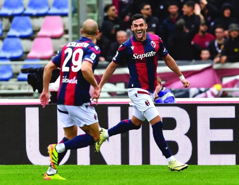 Bologna’s Charalampos Lykogiannis (right) celebrates after scoring against Salernitana in the Serie A on Monday. (Reuters)