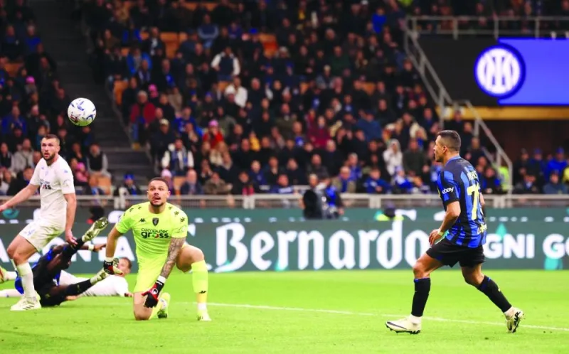 
Inter Milan’s Alexis Sanchez (right) scores against Empoli during the Serie A match at the San Siro in Milan on Monday night. (Reuters) 