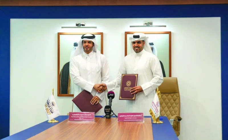 Director General of Qatar Fund for Development Khalifa al-Kuwari (right) and Qatar National Basketball Federation President and Director General of the Local Organising Committee FIBA Basketball World Cup – Qatar 2027 Mohamed Saad al-Meghaiseeb pose after signing the MoU on Wednesday.