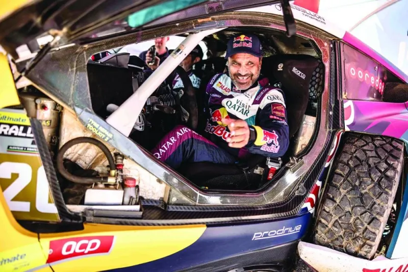 Qatar’s Nasser Saleh al-Attiyah and his French co-driver Edouard Boulanger (also right) during the Ultimate Rally-Raid Portugal in Badajoz on Friday evening.