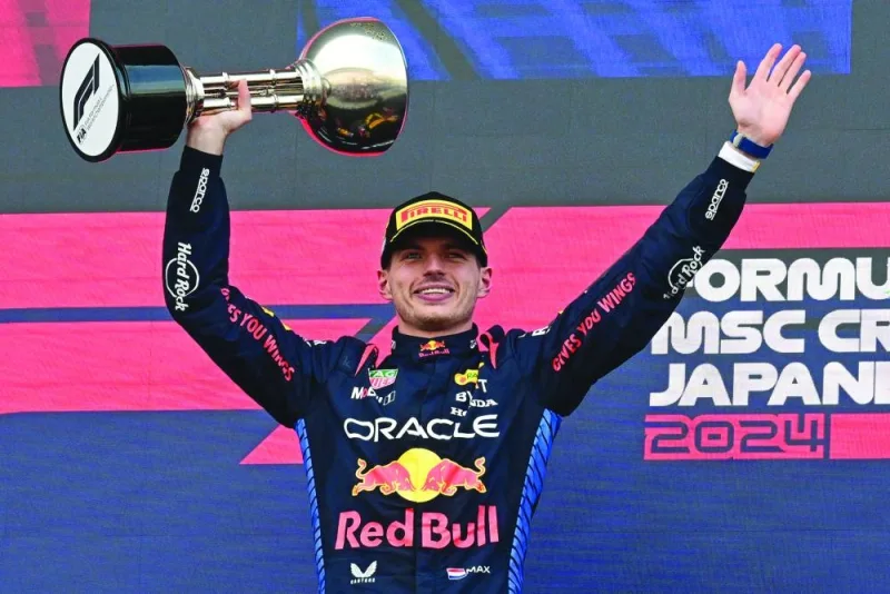 
Red Bull Racing’s Dutch driver Max Verstappen celebrates on the podium after the end of the Formula One Japanese Grand Prix race at the Suzuka circuit in Suzuka, Mie prefecture, yesterday. (AFP) 