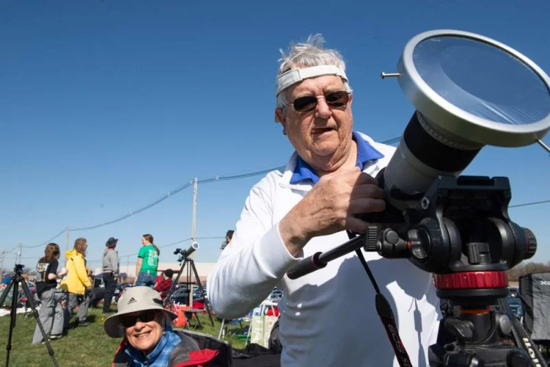 A person prepares his camera to view the total solar eclipse on Monday at the Neil Armstrong Air and Space Museum in Wapakoneta, Ohio. AFP