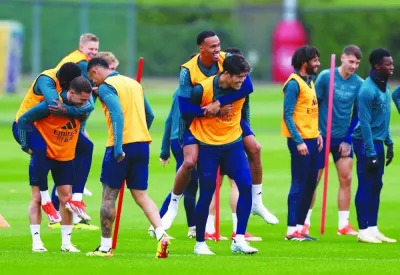 Arsenal players during a training session yesterday, on the eve of the Champions League match against Bayern Munich. (Reuters)