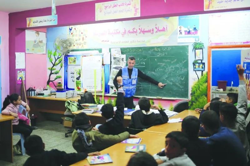 File photo shows Ismail Wahba, director of the UNRWA Taif School in Rafah, teaching an English class in the library of the school housing displaced Palestinians, in Rafah in the southern Gaza Strip, amid the ongoing conflict between Israel and the Hamas movement.