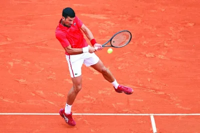 Serbia’s Novak Djokovic plays a backhand return to Russia’s Roman Safiullin during their Monte Carlo Masters match on the Rainier III court at the Monte Carlo Country Club on Tuesday. (AFP)