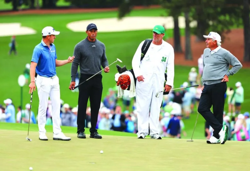 
American golfers Tiger Woods (second left), Fred Couples (right) and Justin Thomas (left) are seen during a practice round at the Augusta National Golf Club, Augusta, Georgia, US. (Reuters) 