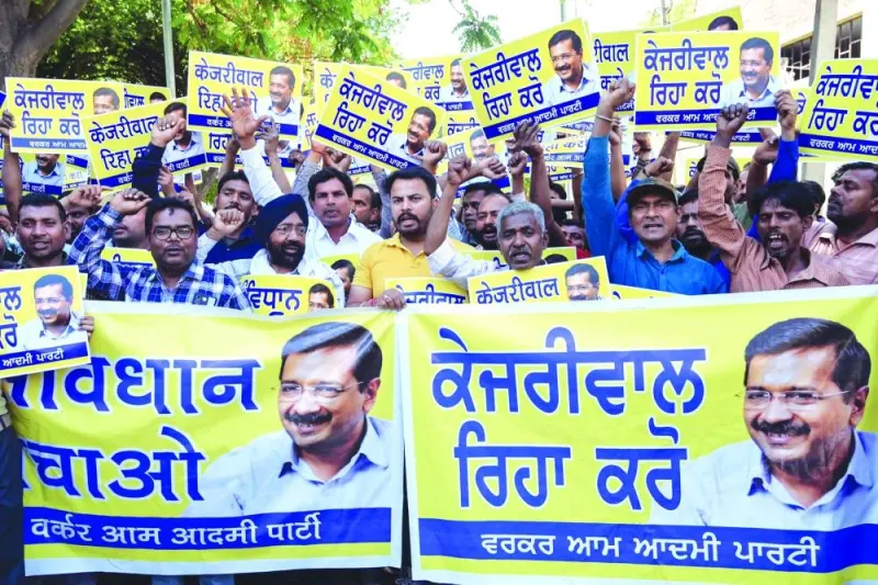 
Supporters and activists of Aam Aadmi Party (AAP) hold placards and posters featuring their leader and Delhi’s Chief Minister Arvind Kejriwal shout slogans during a protest demanding the release of Kejriwal after his arrest in connection with a long-running corruption probe, in Amritsar, India. 