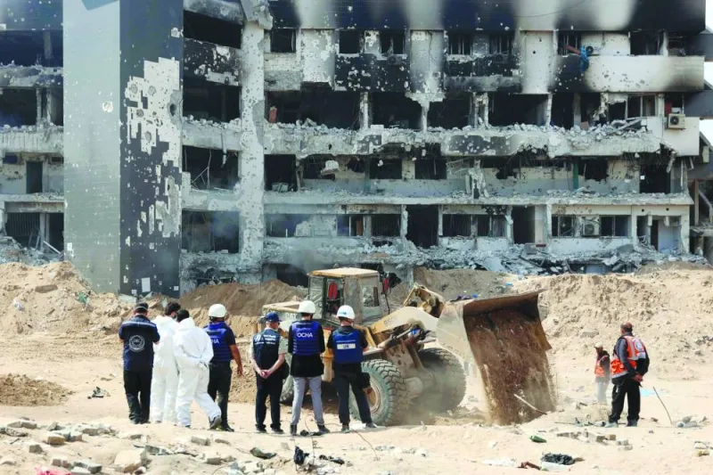 
A UN team visit as Palestinian civil defence recover human remains on the grounds of Al-Shifa hospital, Gaza’s largest hospital, which was reduced to ruins by a two-week Israeli raid, amid the ongoing conflict between Israel and the Palestinian Hamas group. 