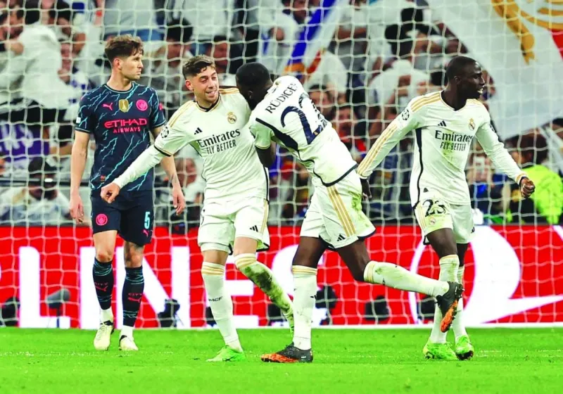 
Real Madrid’s Federico Valverde (second left) celebrates after scoring against Manchester City at the Santiago Bernabeu in Madrid. (Reuters) 