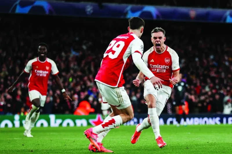 Arsenal’s Leandro Trossard (right) celebrates after scoring the equaliser against Bayern Munich during the Champions League quarter-final first leg match in London on Tuesday. (AFP)