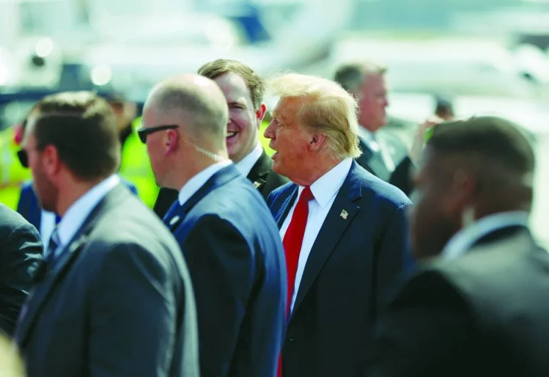 Republican presidential candidate and former US president Donald Trump speaks as he arrives at Hartsfield-Jackson Atlanta International Airport in Atlanta, Georgia, US, on Wednesday.