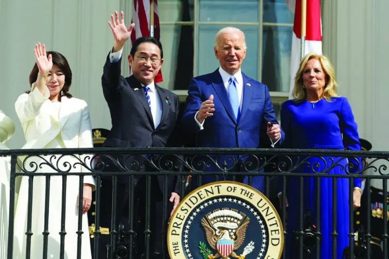Japanese Prime Minister Fumio Kishida, his wife Yuko Kishida, US President Joe Biden and first lady Jill Biden attend an official White House state arrival ceremony on the South Lawn of the White House in Washington, DC, on Wednesday.