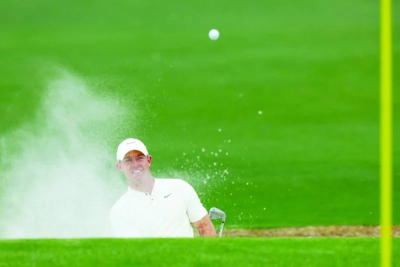 Rory McIlroy of Northern Ireland plays a shot from a bunker on the second hole during a practice round on Wednesday, prior to the 2024 Masters Tournament at Augusta National Golf Club in Augusta, Georgia. (AFP)