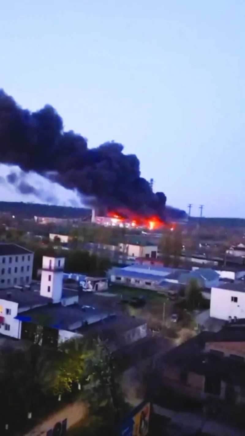 
This picture taken from social media shows smoke and fire at the site of a missile strike at the Trypilska power station in Kyiv region. 
