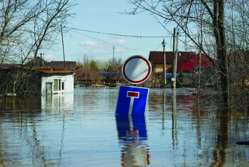 
Right: A road sign is seen at the entrance to the flooded residential area in Orenburg, Russia. 