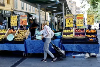 FILE PHOTO: A woman shops at a local market in Nice, France, April 26, 2023. REUTERS/Eric Gaillard