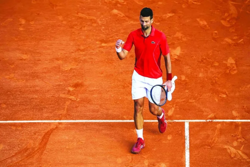 Serbia’s Novak Djokovic celebrates after defeating Australia’s Alex De Minaur in the Monte Carlo ATP Masters quarter-final in Monaco on Friday. (AFP)