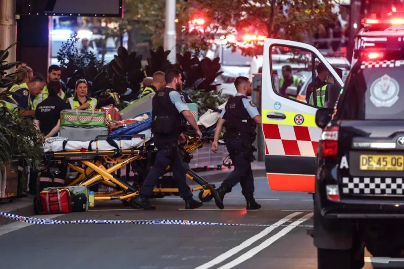 Police and paramedics work outside the Westfield Bondi Junction shopping mall after a stabbing incident in Sydney on Saturday. AFP