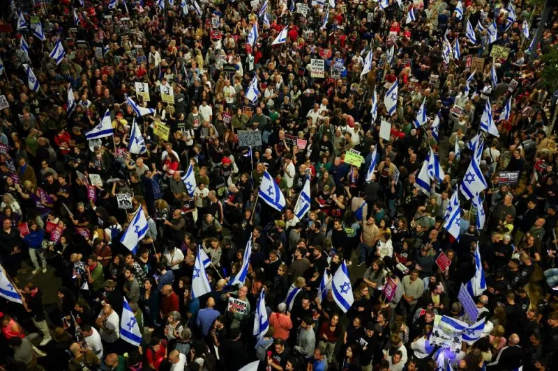People hold Israeli flags as they attend a protest against Israeli Prime Minister Benjamin Netanyahu&#039;s government and to call for the release of hostages, in Tel Aviv, Israel, on Saturday. REUTERS