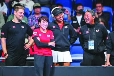 Japan’s Naomi Osaka (second from right) and head coach Ai Sugiyama (second from left) celebrate Japan’s Nao Hibino’s victory against Kazakhstan’s Yulia Putintseva during their match of the Billie Jean Cup qualifying tie in Tokyo on Saturday. (AFP)