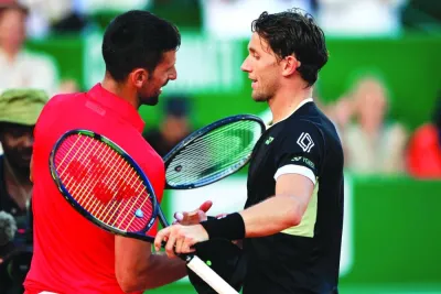 Serbia’s Novak Djokovic (left) shakes hands with Norway’s Casper Ruud at the end of their Monte Carlo ATP Masters semi-final at the Monte Carlo Country Club in Monaco on Saturday. (AFP)