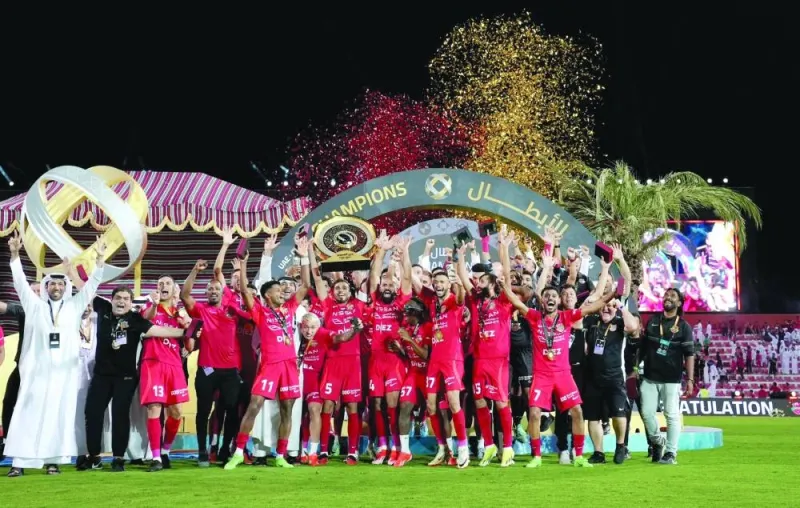 Shabab Al Ahli players celebrate after winning the Qatar-UAE Super Shield at the Rashid Stadium in Dubai on Saturday.
